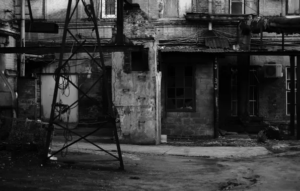 Ukraine, black and white, downtown, brick wall, broken glass, scary backyard, the entrance to the …