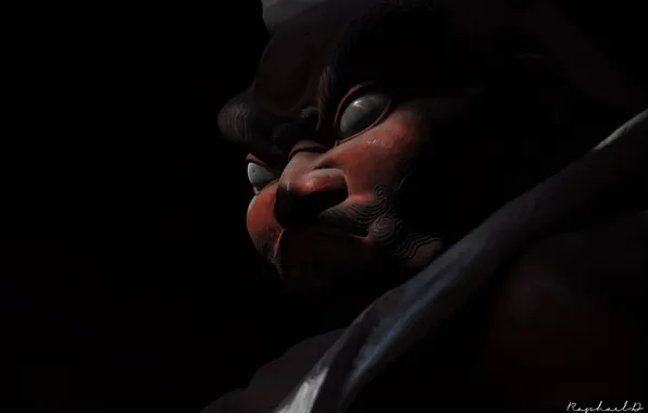 Sculpture, in the dark, demon mask