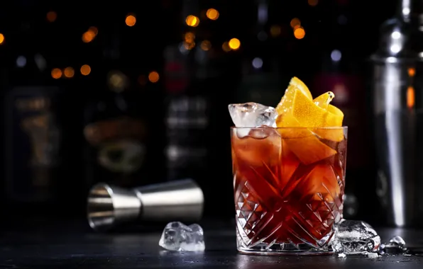 The dark background, table, wine, glass, alcohol, cocktail, dishes, bottle