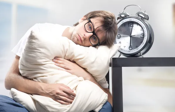 Picture alarm clock, glasses, pillow, male, dissatisfaction, sleepy, six in the morning