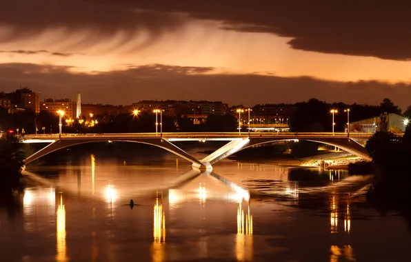 Picture bridge, the city, lights, river, the evening