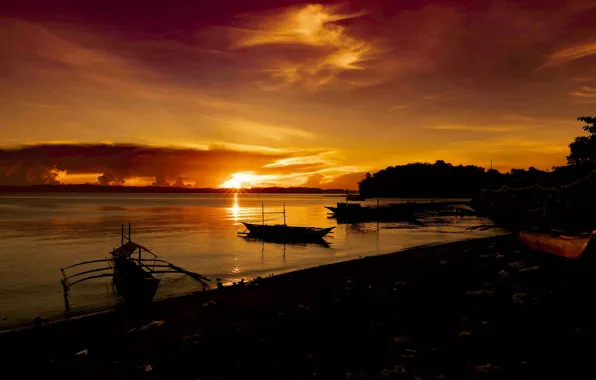 Sea, sunset, boats, silhouettes