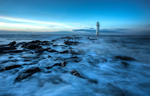 Sea, the sky, stones, lighthouse, the evening, tide