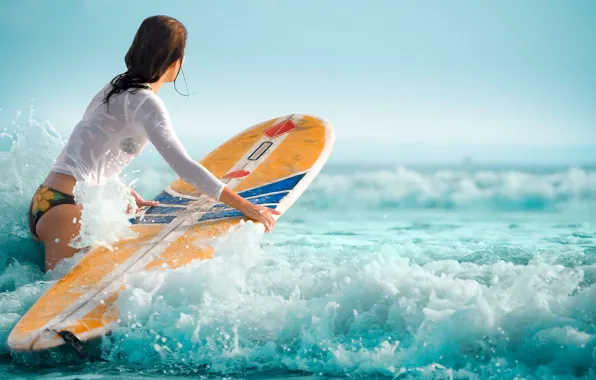 Waves, girl, surfboard