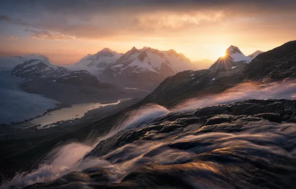 Picture the sun, clouds, snow, mountains, fog, lake, stones, dawn