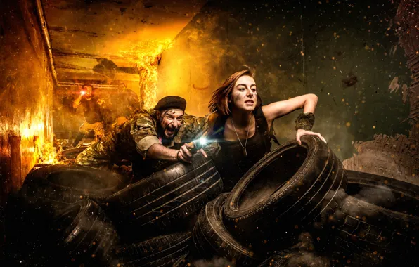 Girl, fire, tires, sparks, flashlight, guy