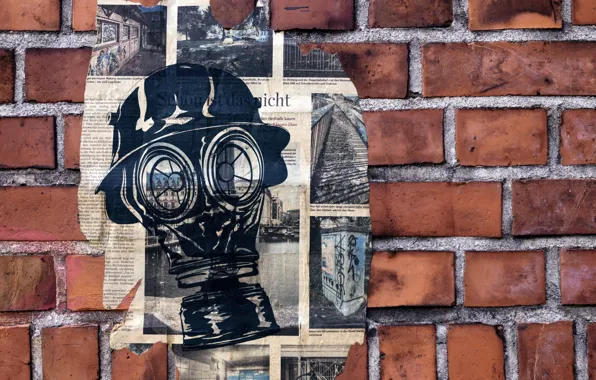 Wall, newspaper, gas mask