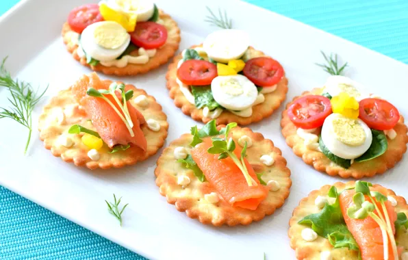 Greens, egg, crackers, tomatoes, sauce, appetizer, salmon, canapés