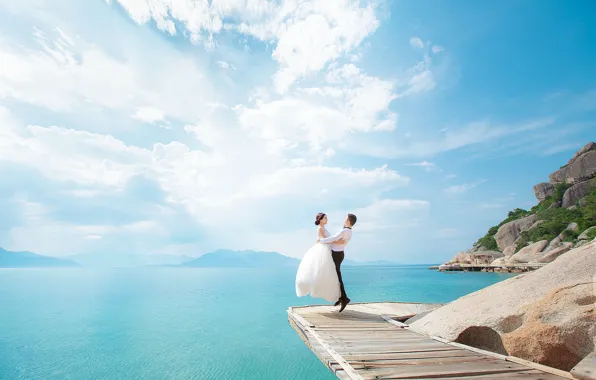 Picture the sky, the sun, Islands, clouds, jump, bouquet, pair, the bride