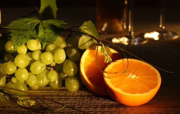 Picture leaves, table, oranges, grapes, twilight, bokeh