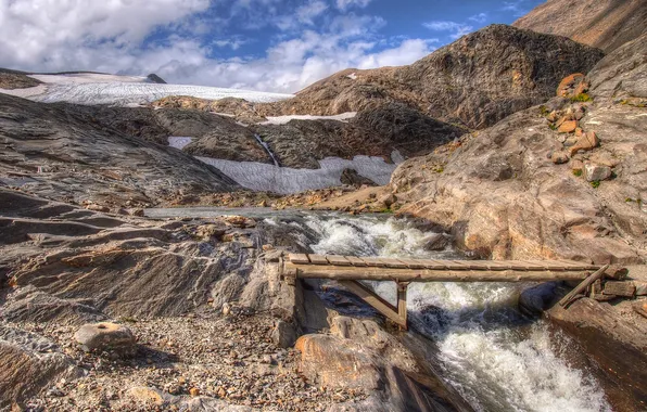 The sky, clouds, mountains, river, stones, glacier, the bridge