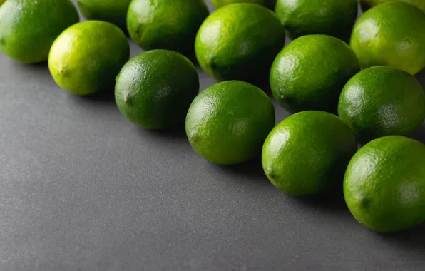 Green, lime, fruit, grey background, citrus, in a row, decomposed, rows