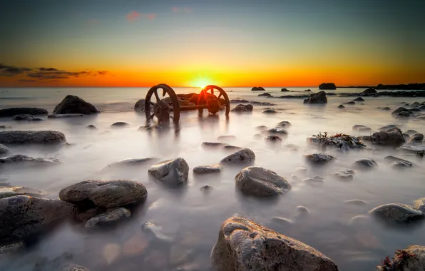Picture sea, sunset, stones, wheel