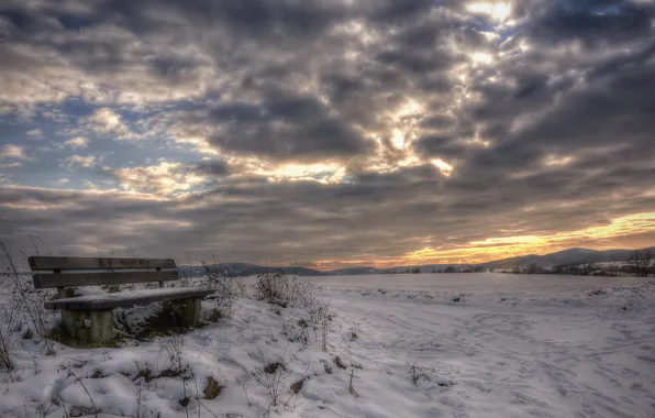 Field, snow, bench