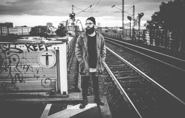 Picture the city, sign, boots, the hood, glasses, railroad, male, beard