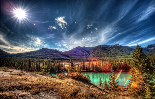 Picture the sky, the sun, clouds, rays, trees, mountains, lake, Canada