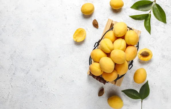 Leaves, light background, apricots, basket