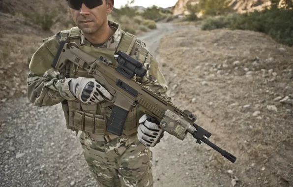 Gun, soldier, sky, weapon, mountains, rocks, man, sand