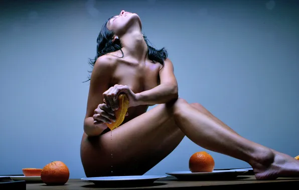 Girl, oranges, juicer