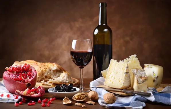 Wine, glass, bottle, cheese, bread, knife, nuts, garnet