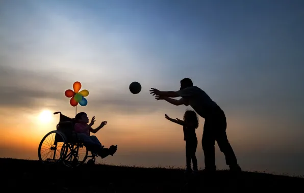 Children, the game, the ball, silhouettes