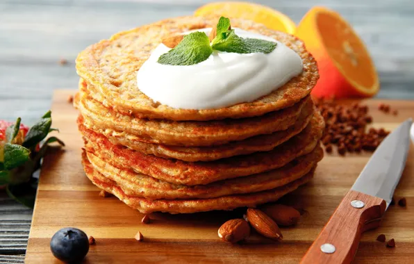 Orange, cream, mint, almonds, pancakes