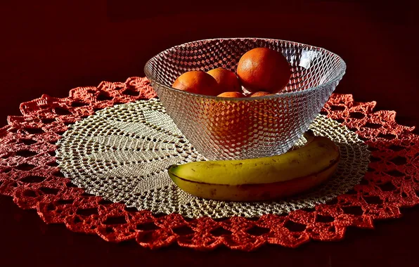 Banana, napkin, tangerines, vase