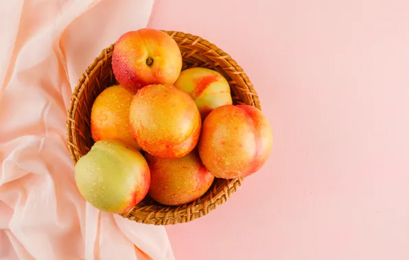 Drops, fabric, bowl, fruit, peaches, pink background, network, the view from the top