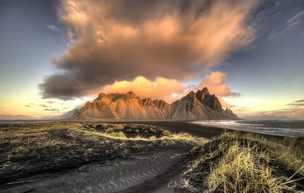 The sky, grass, clouds, mountains, rocks, hills, shore, dal