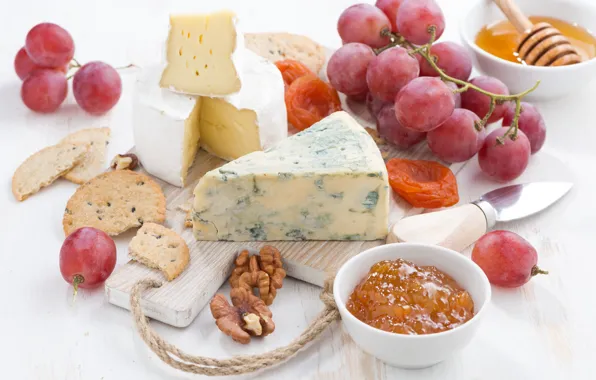 Cheese, grapes, nuts, jam, dried apricots