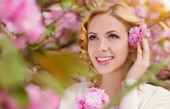 Picture look, girl, joy, flowers, branches, nature, smile, spring