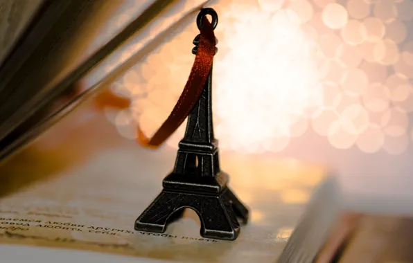Eiffel tower, tape, book, figurine, keychain, page, souvenir, lines
