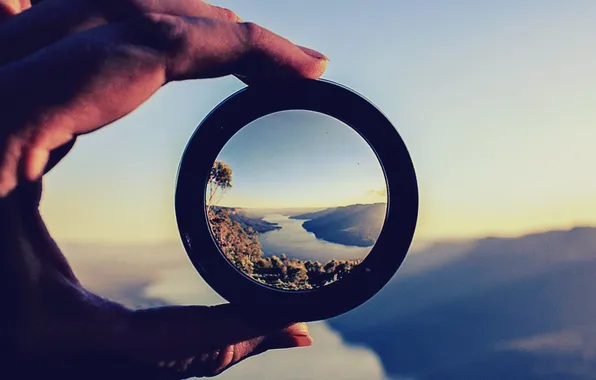 Picture landscape, hand, magnifying glass