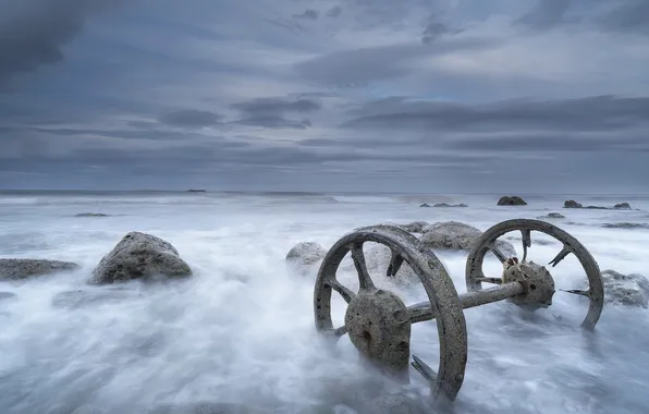 Sea, stones, wheel