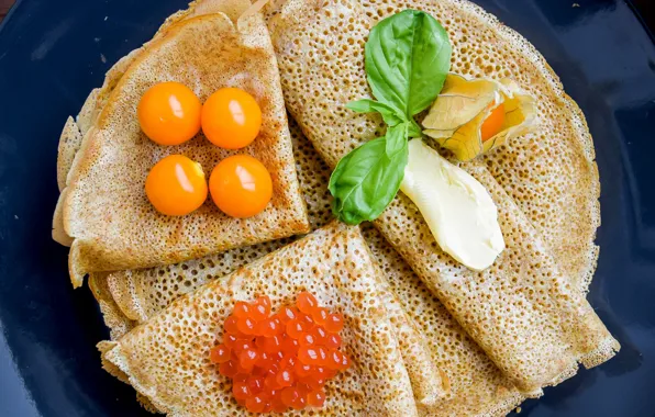 Pancakes, caviar, physalis, sour cream