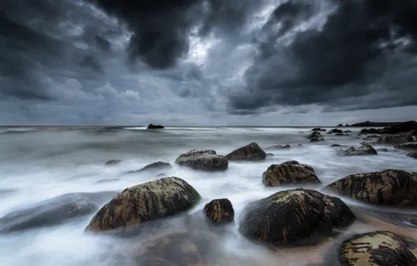 Picture clouds, stones, France, Celtic sea, gloomy sky