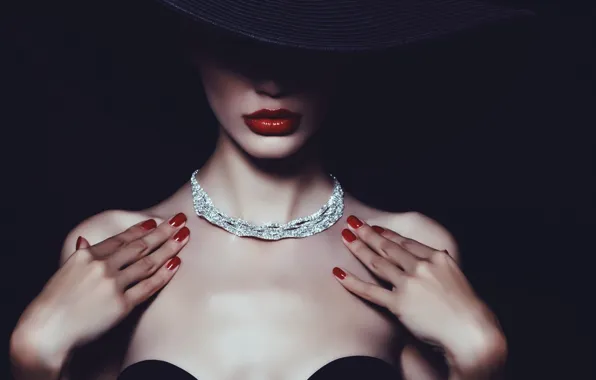 Picture the dark background, shadow, hat, necklace, hands, makeup, lips, hat