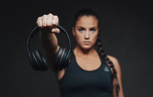 Woman, headphones, hand