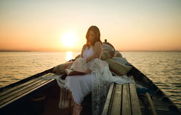 Picture girl, sunset, lake, boat, book