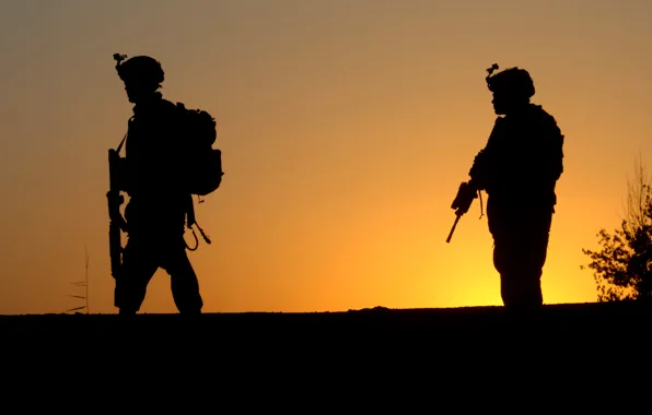 Picture sunset, silhouettes, machines, us army