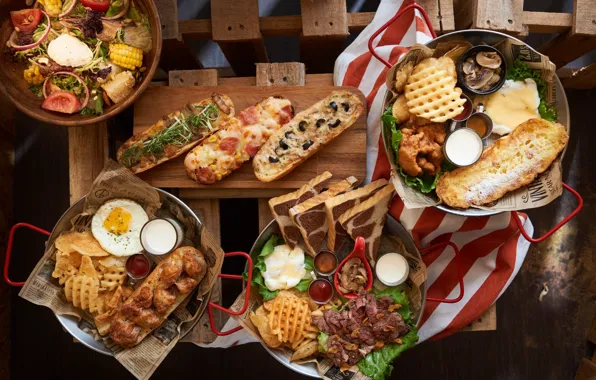 Meat, vegetables, chips, sandwiches, cuts