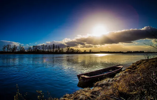 Picture the sun, clouds, river, boat