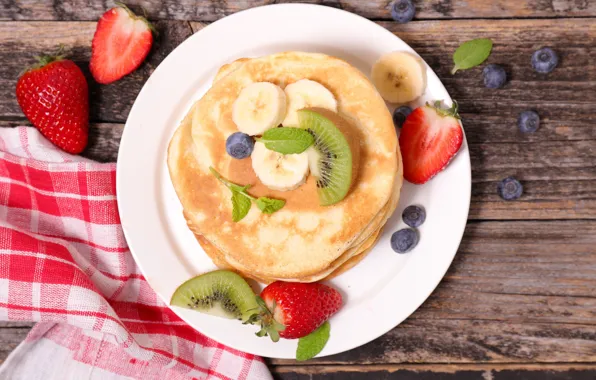 Kiwi, strawberry, banana, blueberries, pancake