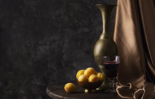 The dark background, table, wine, glass, silk, fabric, vase, bowl