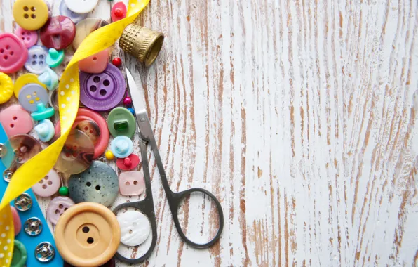 Picture tape, buttons, ribbon, scissors, wooden background, accessories