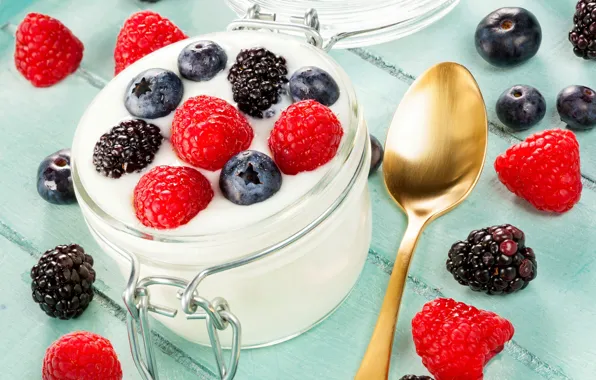 Picture raspberry, blueberries, spoon, yogurt