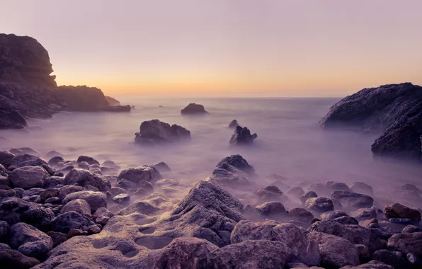 Sea, sunset, stones, rocks, haze