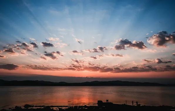 The sky, the sun, clouds, rays, sunset, lake, people, shore