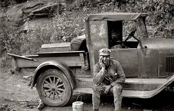 Man, truck, working, black and white, resting