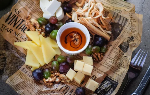 Picture cheese, honey, grapes, nuts, cuts